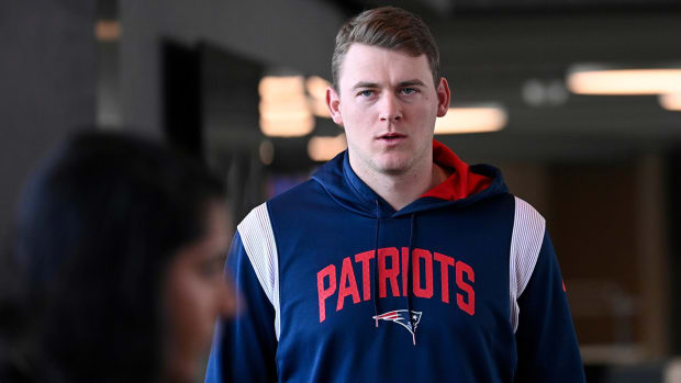 Mac Jones arrives to a press conference in January 2024.